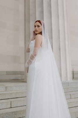 Styled shoot, model wearing a custom Harriett Falvey pearl mantilla wedding veil. Photographed by @anagalloway To see more head to our website